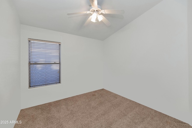 spare room with carpet floors and ceiling fan