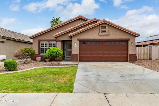 view of front facade with a garage and a front lawn