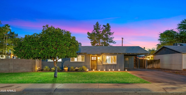 7543 E Portland St, Scottsdale, AZ 85257 - single story home with concrete driveway, a carport, and stucco siding