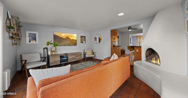 7543 E Portland St, Scottsdale, AZ 85257 - living area with a fireplace, ceiling fan, and tile patterned flooring