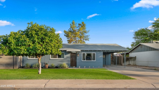 7543 E Portland St, Scottsdale, AZ 85257 - single story home featuring concrete driveway, an attached carport, and roof with shingles
