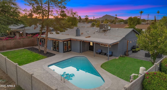 7543 E Portland St, Scottsdale, AZ 85257 - rear view of house featuring a patio and a fenced backyard