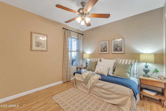 bedroom with hardwood / wood-style flooring and ceiling fan