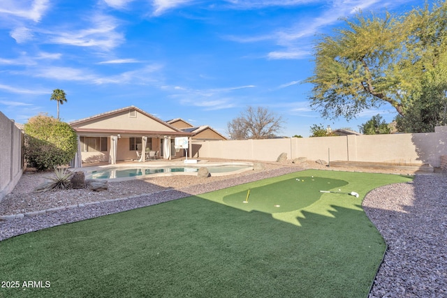 view of yard featuring a patio and a fenced in pool