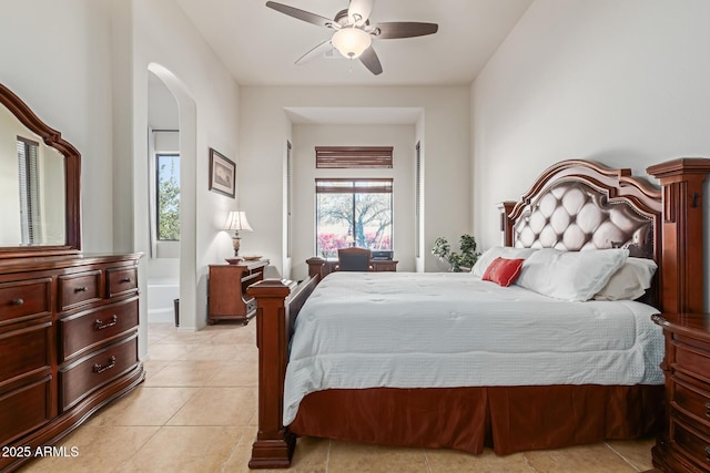 tiled bedroom featuring ceiling fan