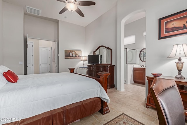 bedroom with ceiling fan and ensuite bathroom