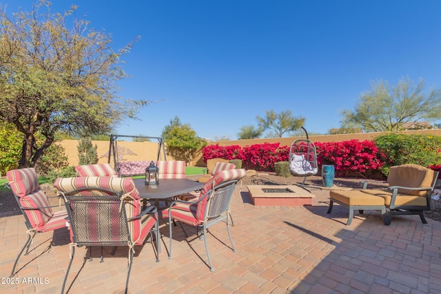 view of patio / terrace with an outdoor fire pit