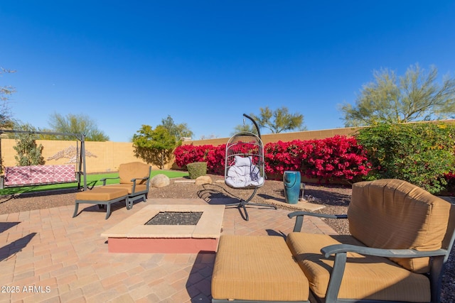 view of patio with a fire pit