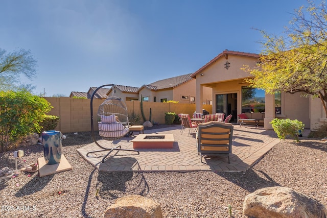 view of patio / terrace with an outdoor living space with a fire pit