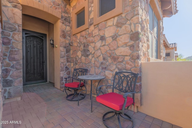 property entrance featuring a patio