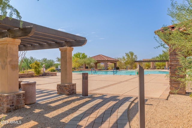 view of pool featuring a pergola and a gazebo