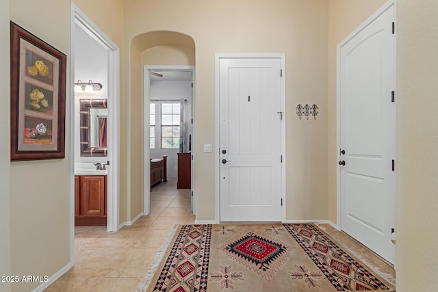 tiled entrance foyer with sink