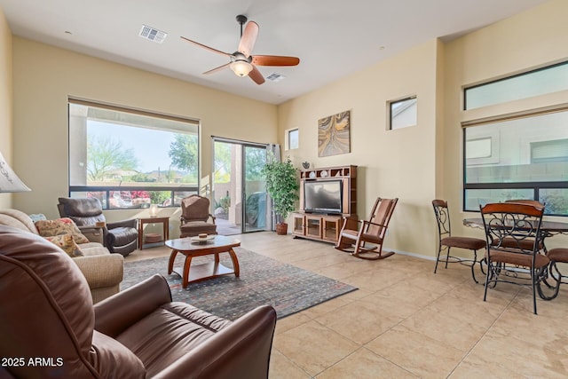 living room featuring ceiling fan and light tile patterned floors