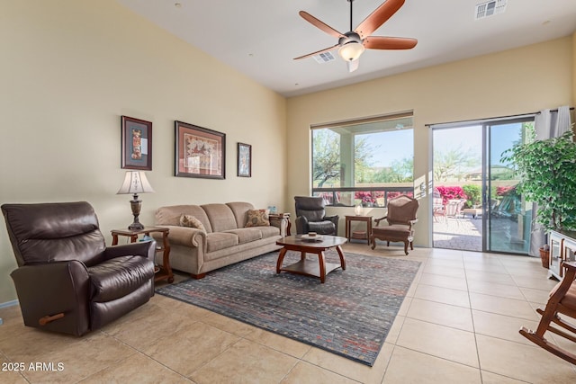 living room featuring light tile patterned floors and ceiling fan