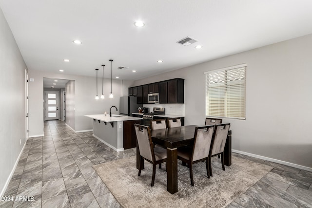 dining area featuring sink