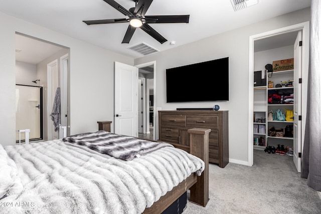 carpeted bedroom featuring ceiling fan and a closet