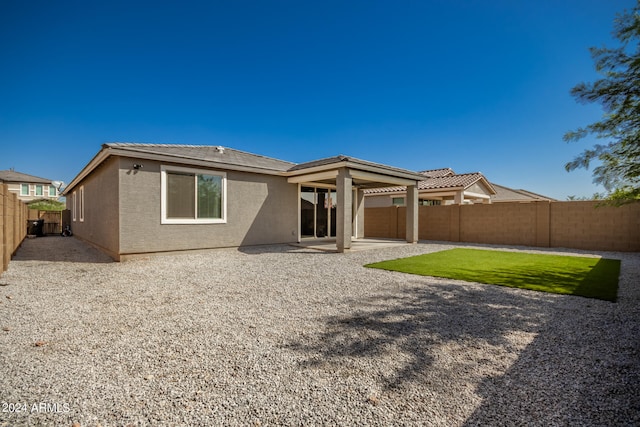 rear view of house with a patio area