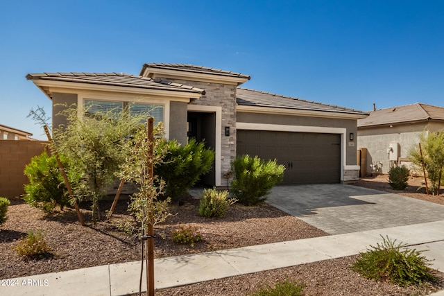 prairie-style home featuring a garage