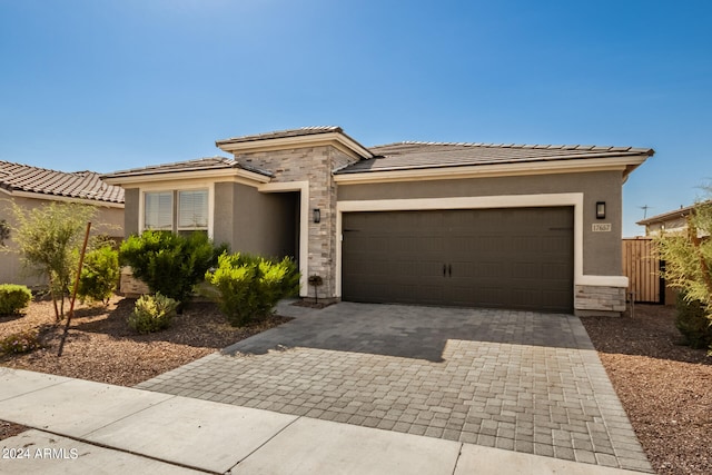 prairie-style house featuring a garage