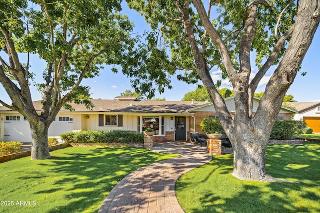 single story home with a garage and a front yard