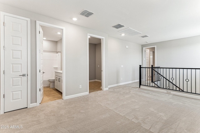 21228 N 58th St, Phoenix, AZ 85054 - empty room featuring light colored carpet, baseboards, and recessed lighting