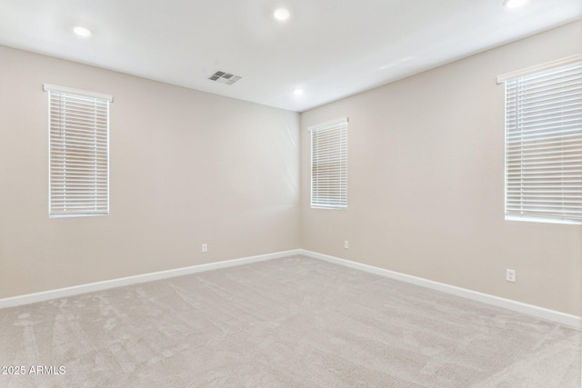 21228 N 58th St, Phoenix, AZ 85054 - unfurnished room with recessed lighting, light carpet, and baseboards