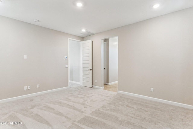 21228 N 58th St, Phoenix, AZ 85054 - spare room with recessed lighting, light colored carpet, and baseboards