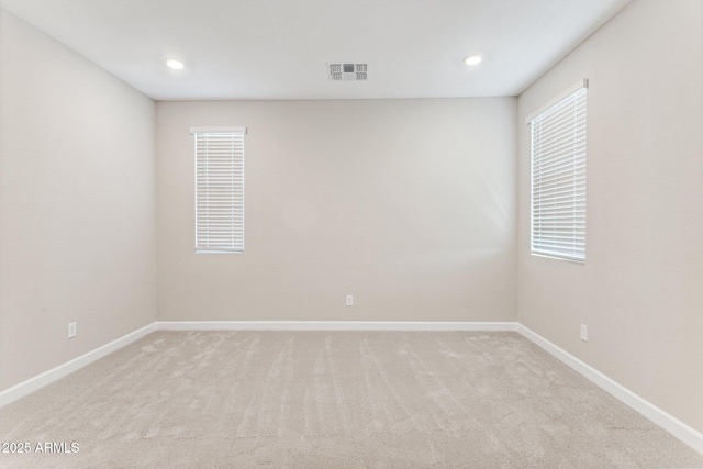 21228 N 58th St, Phoenix, AZ 85054 - unfurnished room featuring light carpet, baseboards, and recessed lighting