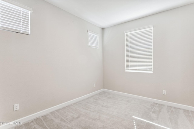 21228 N 58th St, Phoenix, AZ 85054 - carpeted spare room featuring plenty of natural light and baseboards