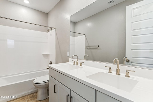 21228 N 58th St, Phoenix, AZ 85054 - full bath featuring toilet, shower / bathtub combination, wood finished floors, and double vanity