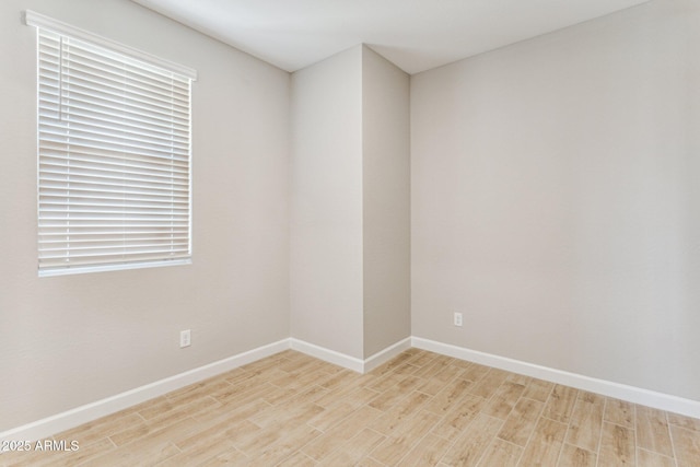 21228 N 58th St, Phoenix, AZ 85054 - unfurnished room with light wood-type flooring and baseboards