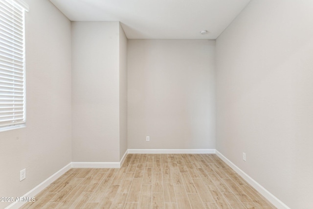 21228 N 58th St, Phoenix, AZ 85054 - spare room featuring light wood-style floors and baseboards