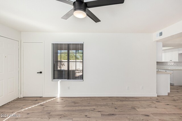 unfurnished room featuring ceiling fan and light hardwood / wood-style floors