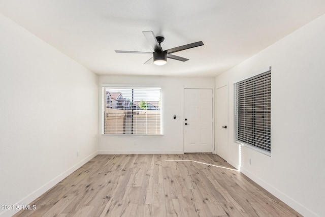 unfurnished room featuring light hardwood / wood-style flooring and ceiling fan