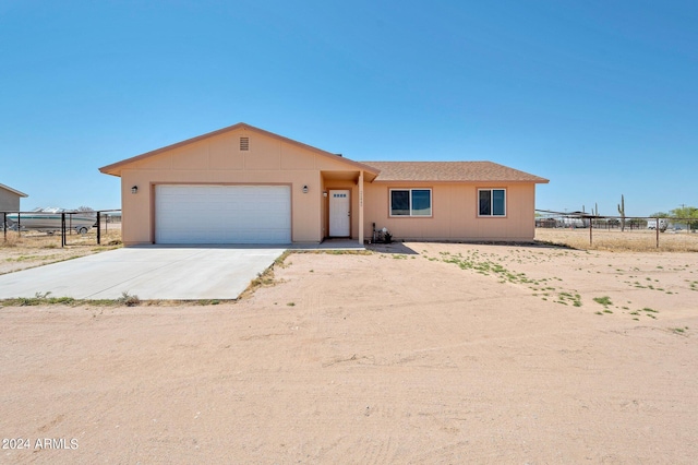 ranch-style home with a garage