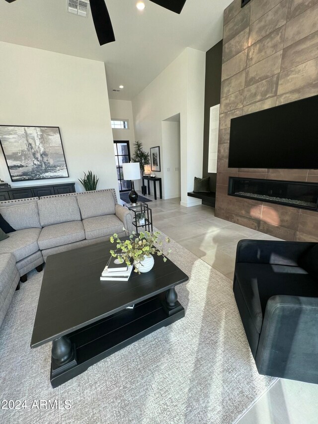 living room featuring a tile fireplace