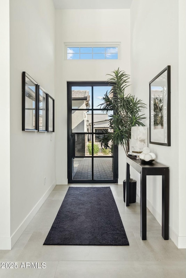 20475 E Indiana Ave, Queen Creek, AZ 85142 - entryway featuring baseboards and a high ceiling