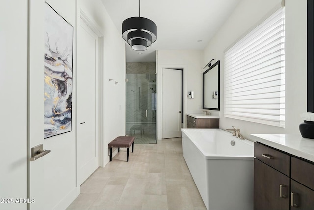 20475 E Indiana Ave, Queen Creek, AZ 85142 - full bathroom featuring a shower stall, vanity, and a soaking tub