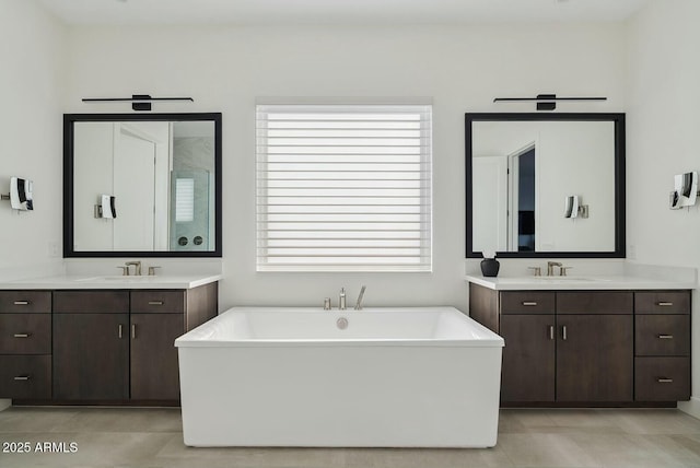 20475 E Indiana Ave, Queen Creek, AZ 85142 - bathroom featuring a freestanding bath, two vanities, and a stall shower