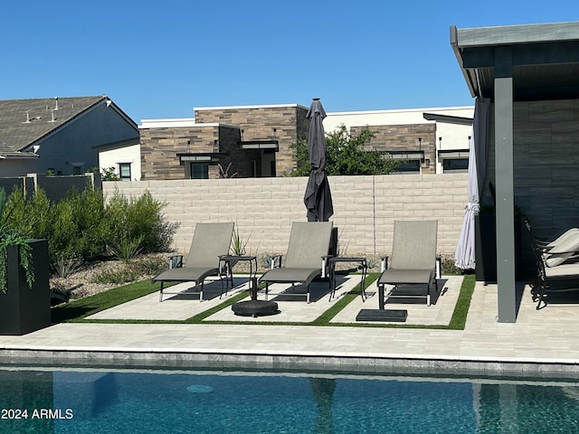 view of swimming pool featuring a patio area