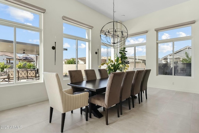 20475 E Indiana Ave, Queen Creek, AZ 85142 - dining room with healthy amount of natural light, a chandelier, and baseboards