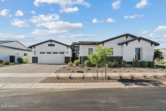20475 E Indiana Ave, Queen Creek, AZ 85142 - modern farmhouse style home featuring decorative driveway, stucco siding, and a garage