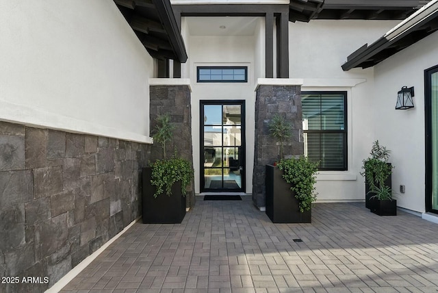20475 E Indiana Ave, Queen Creek, AZ 85142 - doorway to property featuring stucco siding and stone siding