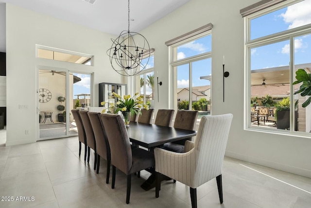 20475 E Indiana Ave, Queen Creek, AZ 85142 - dining room with ceiling fan, a chandelier, baseboards, and a high ceiling