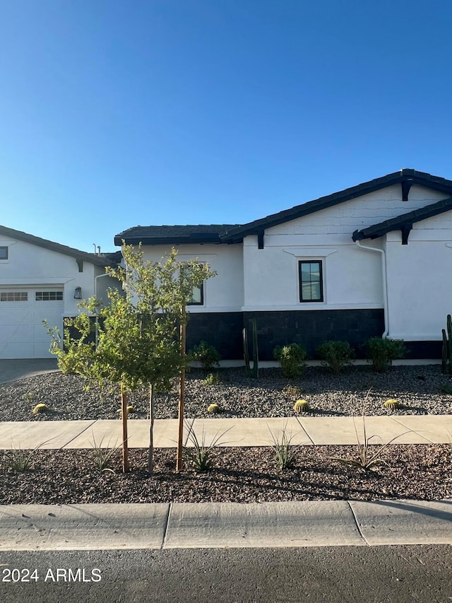 view of front of property with a garage