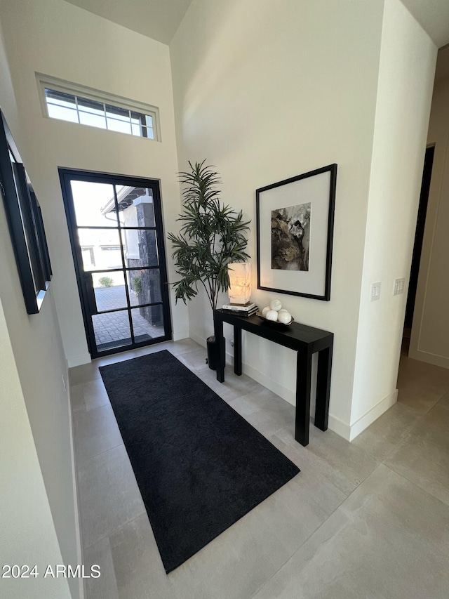 entryway with a high ceiling