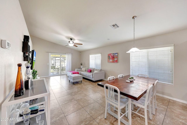 2716 W Sunland Ave, Phoenix, AZ 85041 - dining room with lofted ceiling, light tile patterned floors, a ceiling fan, and baseboards