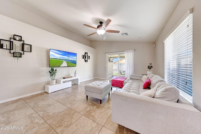 2716 W Sunland Ave, Phoenix, AZ 85041 - living room with a ceiling fan, vaulted ceiling, baseboards, and light tile patterned flooring