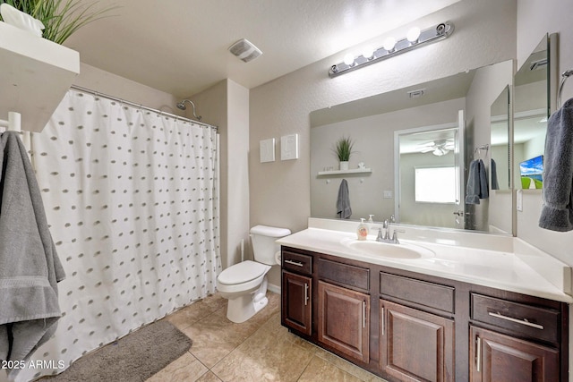2716 W Sunland Ave, Phoenix, AZ 85041 - full bathroom with toilet, vanity, ceiling fan, tile patterned flooring, and a shower with shower curtain