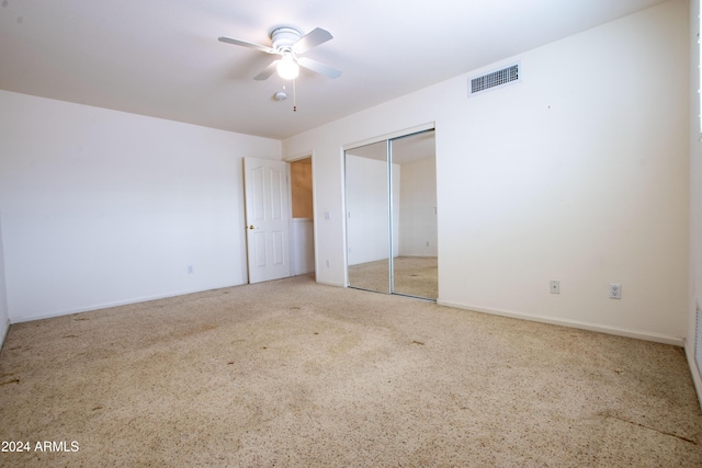 unfurnished bedroom with visible vents, a closet, and ceiling fan